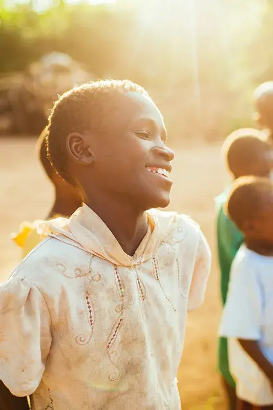 Child smiling in the sunshine