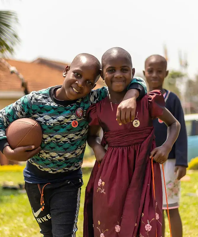 Children smiling while playing outside