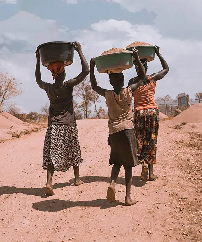 Women and child carrying buckets
