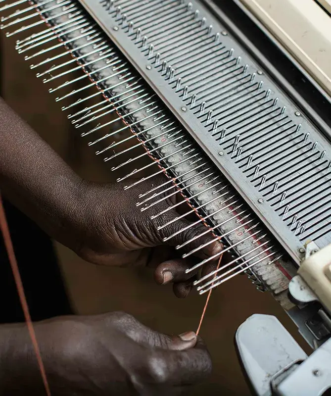 Person weaving thread