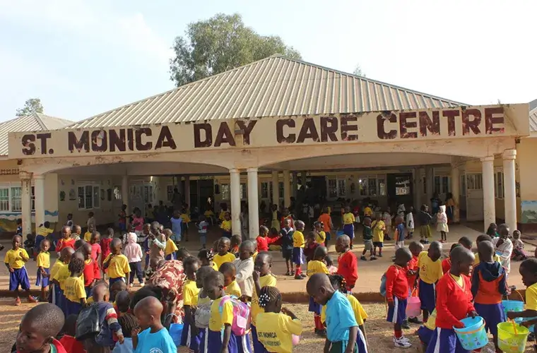 Children outside of St. Monica's Day Care Centre
