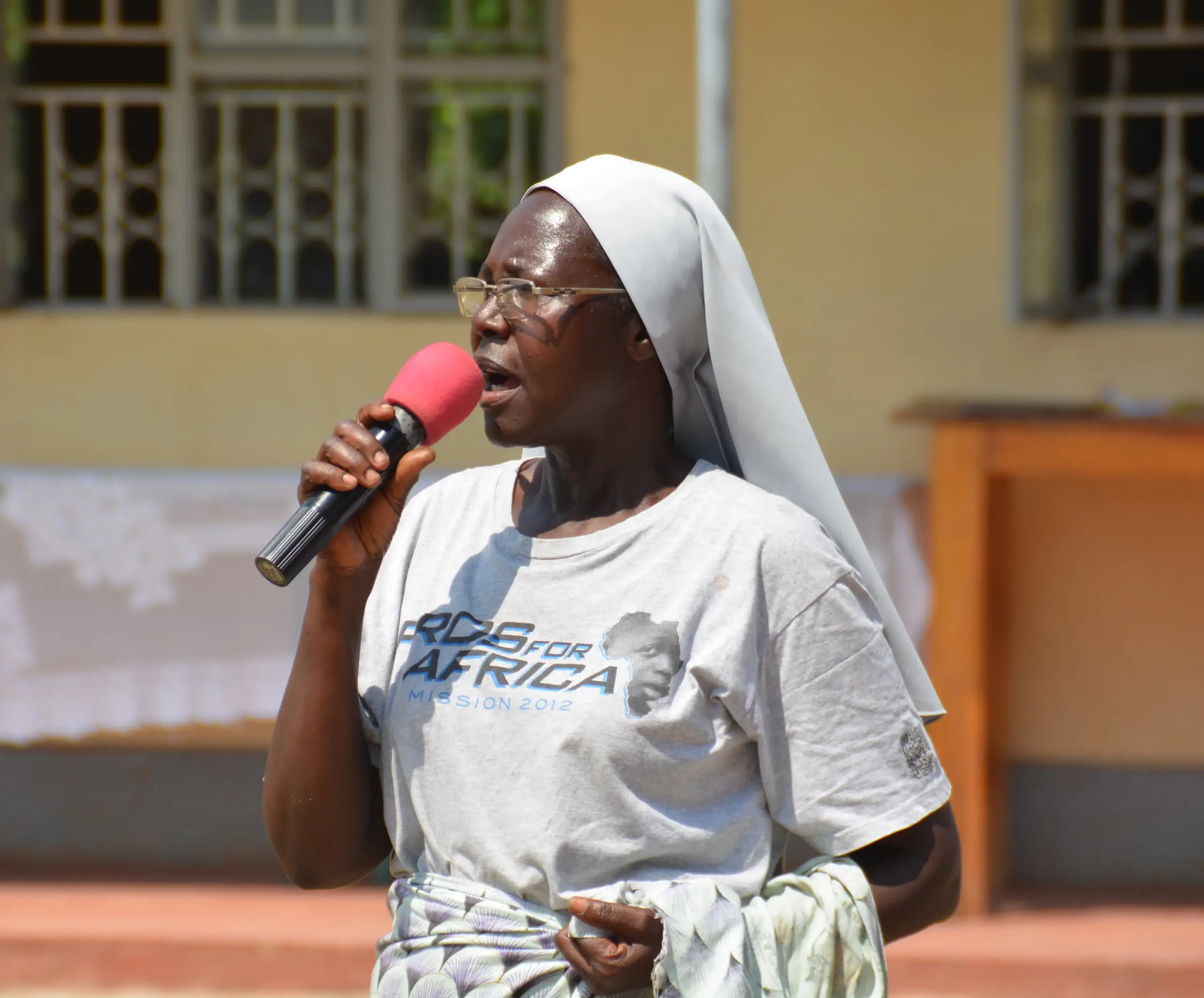 Sister speaking at Pros for Africa event