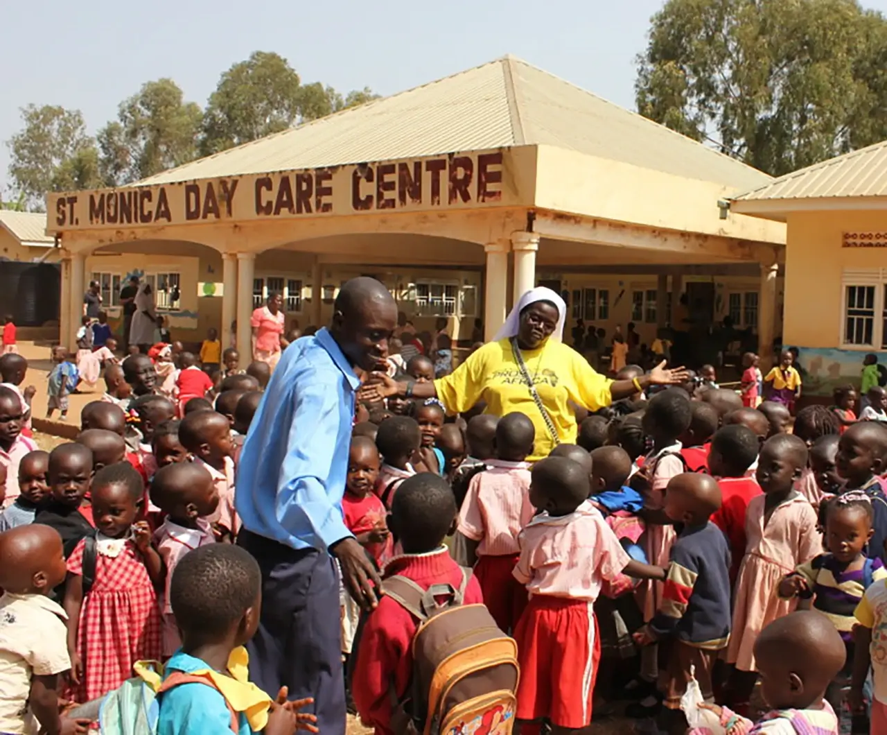 Sister Rosemary and teacher with young students