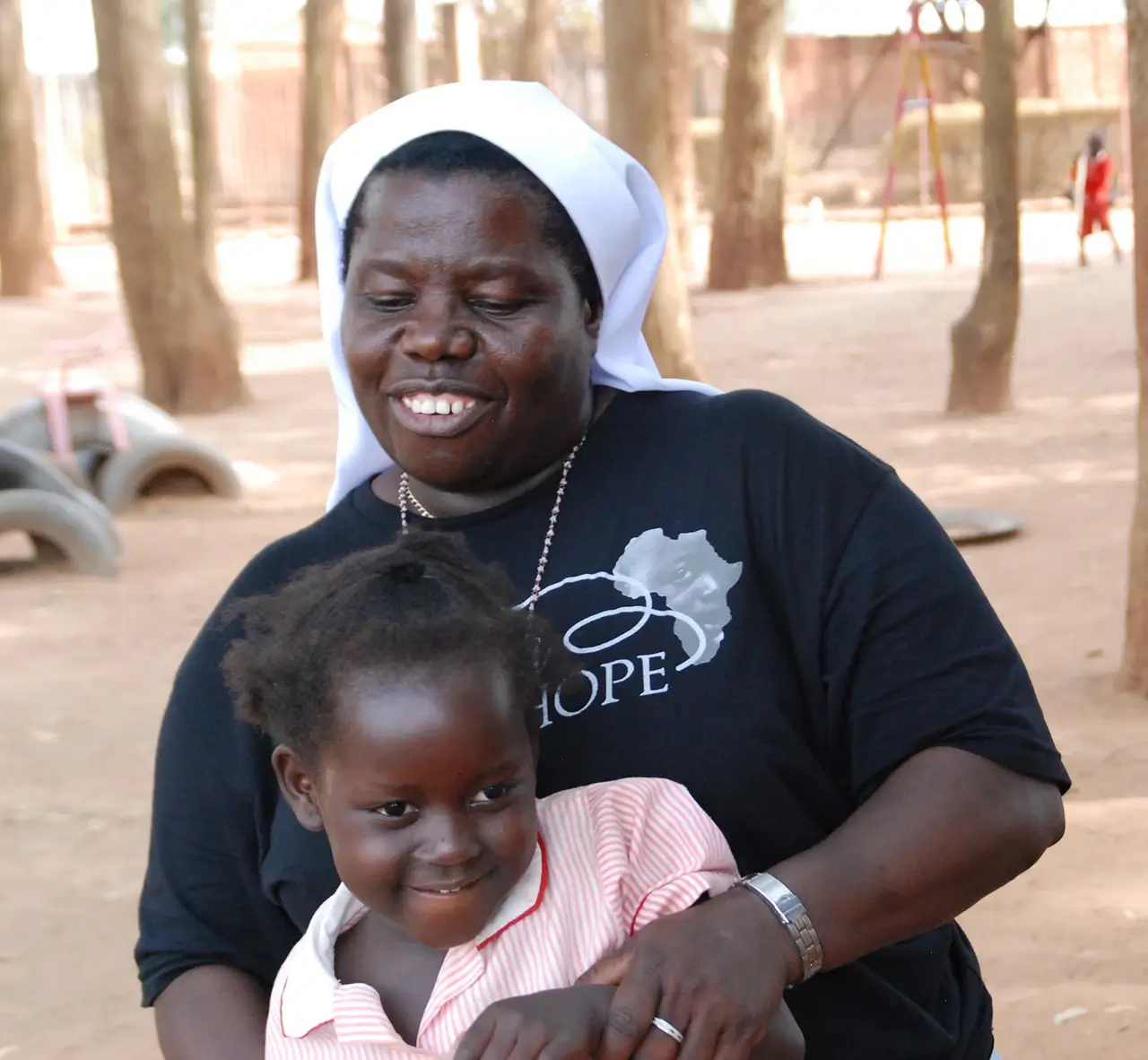 Sister Rosemary and child smiling